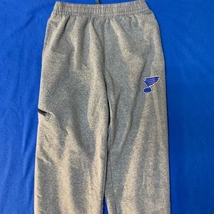 Grey joggers, blues logo
